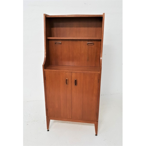 473 - 1970s TEAK ILLUMINATED CABINET
with a shelf above shaped sides and an illuminated shelf with a fall ... 