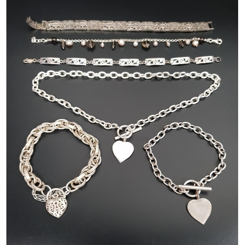 149 - SELECTION OF SILVER BRACELETS
comprising a maracsite set rectangular link bracelet, a pearl and smok... 