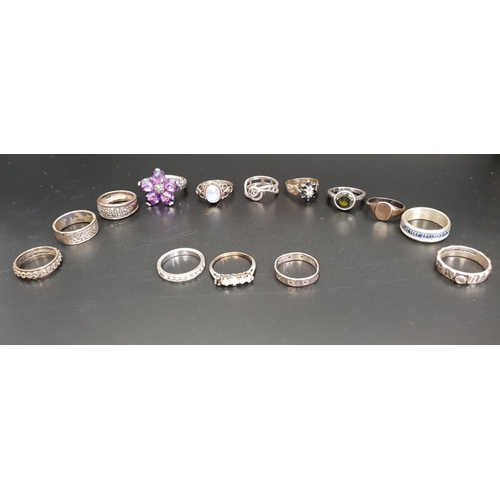 155 - SELECTION OF FOURTEEN SILVER RINGS
of various sizes and designs, including a sapphire and diamond cl... 