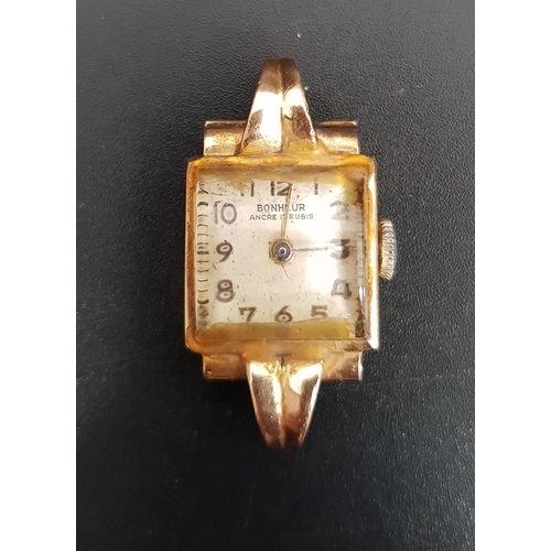 166 - LADIES EIGHTEEN CARAT GOLD CASED BONHEUR ANCRE 17 RUBIS WRISTWATCH
the square dial with Arabic numer... 