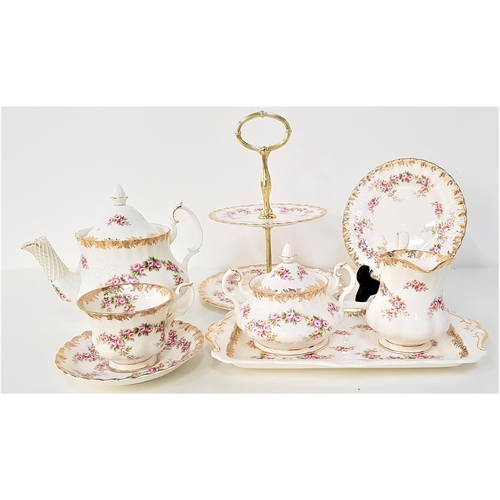 224 - ROYAL ALBERT TEA SERVICE
in the Dimity Rose pattern, comprising eight cups, six saucers, tea pot, tw... 