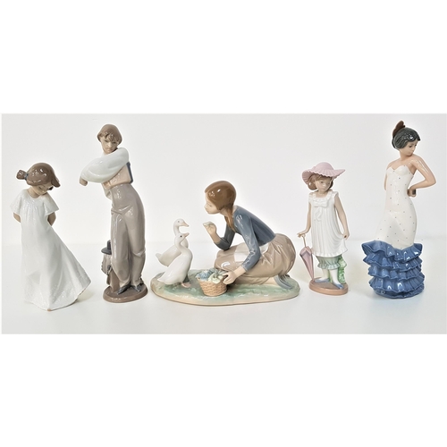 250 - LLADRO FIGURINE
depicting a young girl feeding ducks, 23cm long and four Nao figurines - male Spanis... 