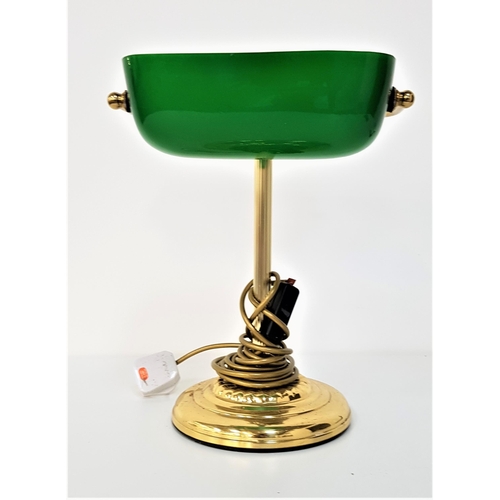 298 - ANTIQUE STYLE DESK LAMP
raised on a circular brass stepped base and tubular column, with an adjustab... 