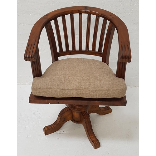 490 - TEAK CAPTAIN'S STYLE SWIVEL CHAIR
with a hoop back above a solid seat with a shaped cushion, raised ... 