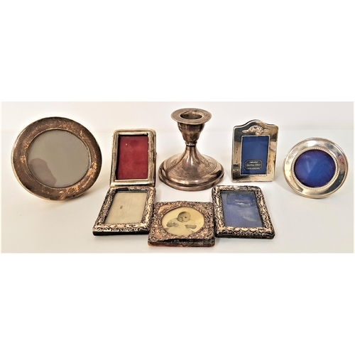 218 - SELECTION OF SEVEN SILVER SMALL PHOTOGRAPH FRAMES
and a Walker and Hall chamber stick, most with rub... 