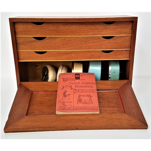 182 - MAHOGANY WATCH REPAIRERS CABINET
with a fold down front revealing three drawers with an assortment o... 