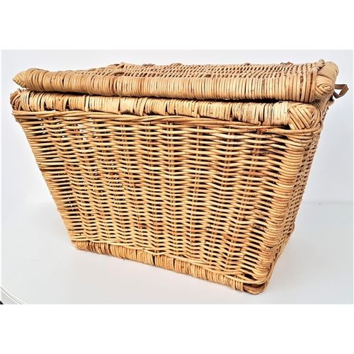 276 - WICKER LAUNDRY BASKET
with a lift up lid and side carrying handle holes, 48cm x 66cm x 46cm