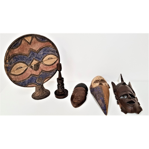 305 - FOUR AFRICAN CARVED DECORATIVE MASKS
including a Bamana Kone mask, a Punu Okuyi style mask, a native... 