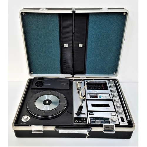 344 - SANYO PORTABLE MUSIC CENTRE
model G-2615N-2, contained in a briefcase, the lid forming two speakers,... 