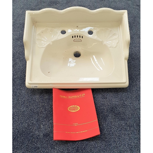 430 - THOMAS CRAPPER & CO. LAVATORY BASIN
with a shaped and raised back above two shell shaped soap recess... 