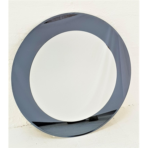 468 - MODERN CIRCULAR WALL MIRROR
with a bevelled smoked glass mirrored frame and circular bevelled plate,... 