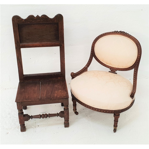 487 - LATE VICTORIAN NURSING CHAIR
with an oval padded back above an oval stuffover seat, standing on turn... 