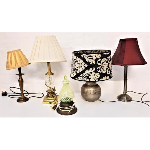 324 - FIVE ASSORTED TABLE LAMPS
including a steel lamp raised on a circular base with a burgundy shaped sh... 