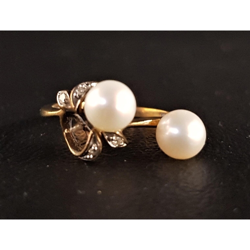 67 - PEARL AND DIAMOND DRESS RING
the two peals (one loose) within diamond set surround, on nine carat go... 