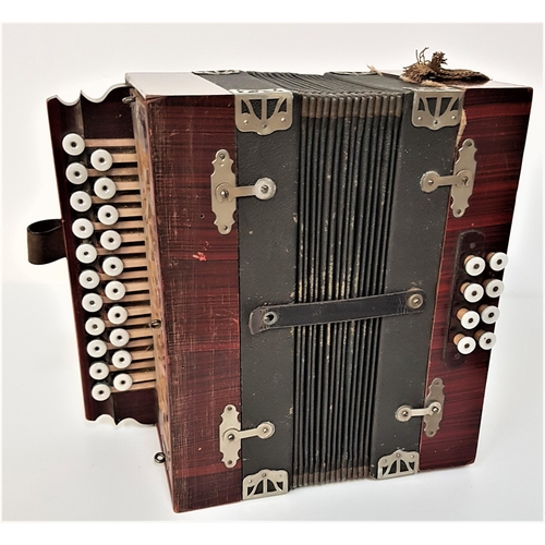 219 - VINTAGE CONTINENTAL ACCORDIAN
with a simulated rosewood body with a fret carved side panel