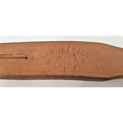 169 - VINTAGE LEATHER TAWSE
with two tails, marked John J. Dick, Lochgelly, 61.7cm long, the reverse writt... 