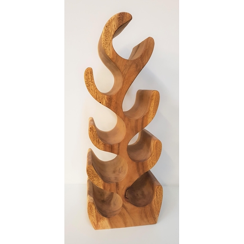 370 - CHELSEA HOME & LEISURE TEAK WINE RACK
of one piece construction, to hold eight bottles, 70cm high