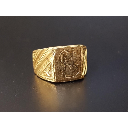 19 - UNMARKED HIGH CARAT GOLD DRESS RING
with central monogram and decorative shoulders, ring size S and ... 