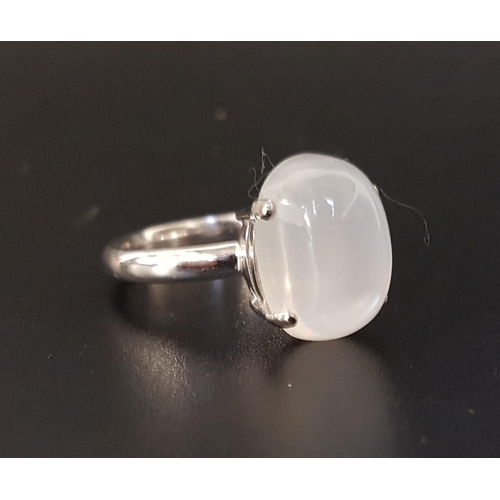 24 - UNUSUAL MOONSTONE DRESS RING
the large cabochon moonstone approximately 10cts, on eighteen carat whi... 