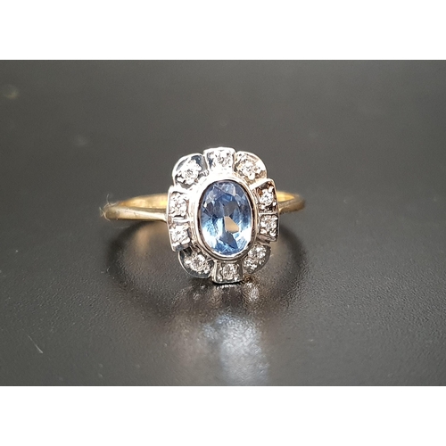 5 - BLUE TOPAZ AND DIAMOND CLUSTER RING
the central bezel set oval cut blue topaz approximately 0.7cts, ... 