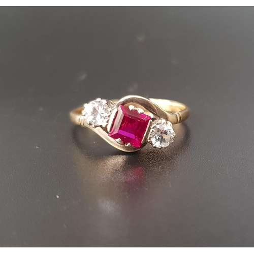 34 - RUBY AND CLEAR GEM SET THREE STONE RING
the central square cut ruby approximately 0.7cts flanked by ... 