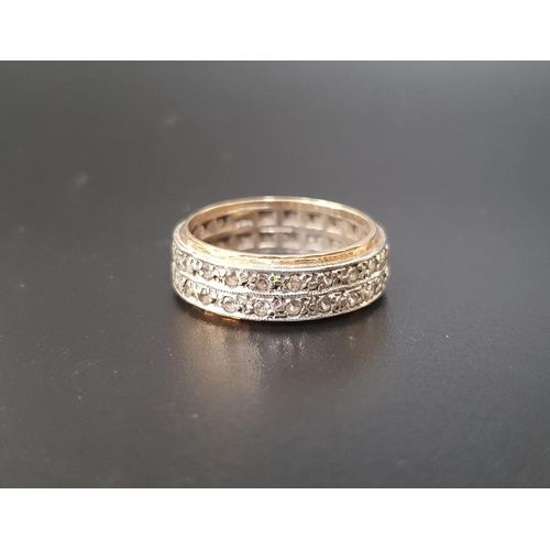 35 - CLEAR GEM SET ETERNITY RING
possibly white sapphire, in nine carat gold, the two rows of gemstones i... 