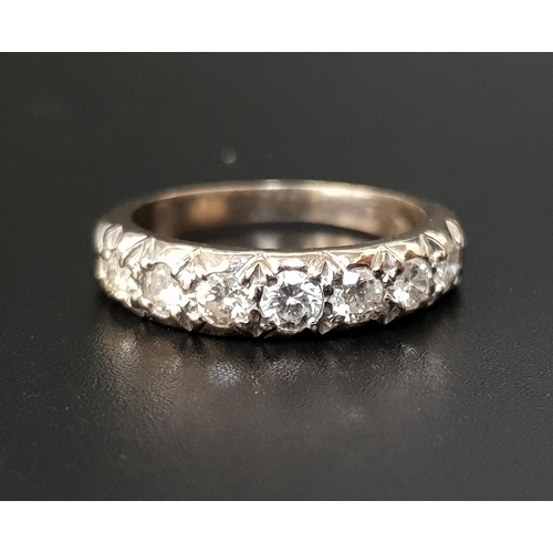 61 - DIAMOND HALF ETERNITY RING
the seven graduated diamonds totaling approximately 0.9cts, in eighteen c... 