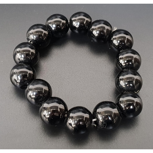 65 - ONYX BEAD BRACELET
formed with fourteen beads