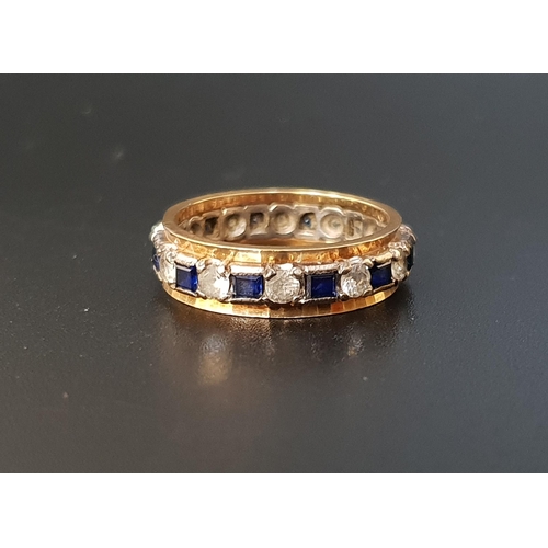 76 - BLUE SAPPHIRE AND CLEAR GEM SET ETERNITY RING
in nine carat gold, ring size O and approximately 4 gr... 