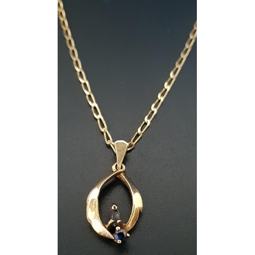 93 - SAPPHIRE SET PENDANT 
in unmarked gold and on nine carat gold chain, total weight approximately 3.8 ... 