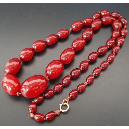 97 - GRADUATED AMBER BEAD NECKLACE
the beads individually knotted, 72cm long and approximately 63 grams