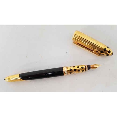 187 - PANTHERE DE CARTIER GOLD PLATED AND ENAMEL FOUNTAIN PEN
dated 1990 and numbered 051882, with eightee... 