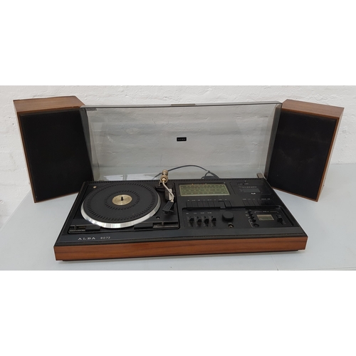 220 - ALBA 9072 MUSIC SYSTEM 
in a teak case with a smoked plastic lift up lid revealing a turntable, cass... 