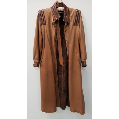 226 - SERGE MIKO LADIES FULL LENGTH COAT
in brown leather with a matching belt, lizard collar, shoulder an... 