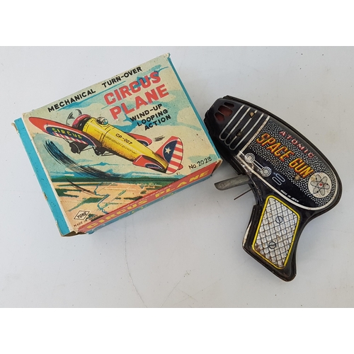 251 - YONE OF JAPAN TINPLATE CIRCUS PLANE
with a clockwork mechanism and original box, together with a tin... 