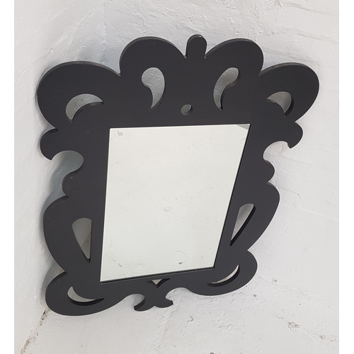 321 - ORNATE SHAPED WALL MIRROR
the pierced and carved frame with a rectangular plate, 117cm x 85cm