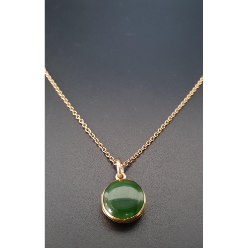 127 - JADE SET LOCKET PENDANT
the circular pendant in unmarked gold and on nine carat gold chain, the pend... 