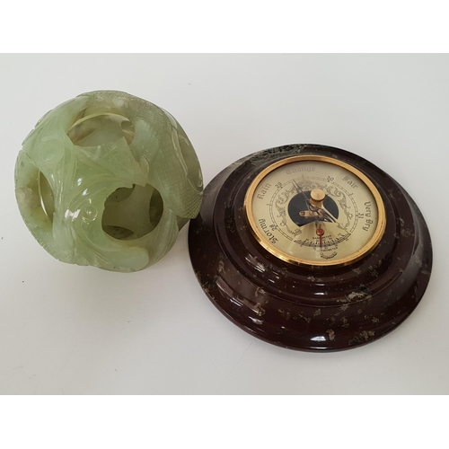 197 - CHINESE SOAPSTONE PUZZLE BALL
with carved decoration and five spheres, together with a desk aneroid ... 