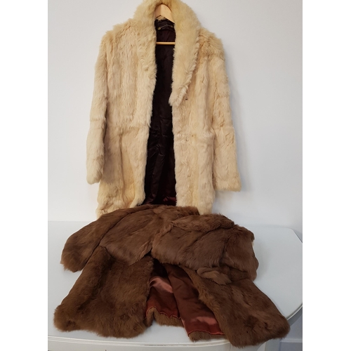 235 - FOUR LADIES CONEY FUR COATS
in brown, camel and cream, together with another fawn fur coat (4)