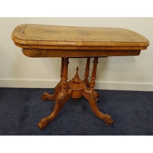 374 - VICTORIAN WALNUT AND CROSSBANDED CARD TABLE
with a rotating fold over baize lined top, on four turne... 