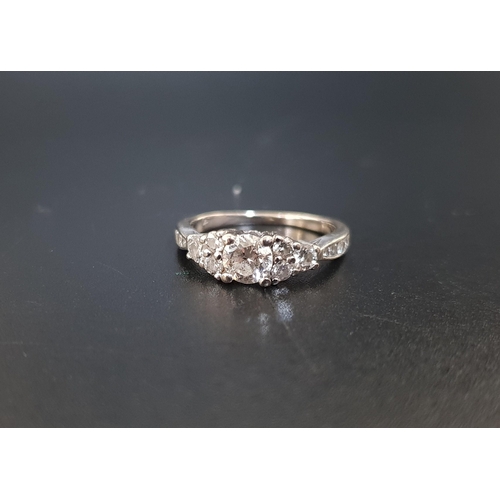 21 - DIAMOND CLUSTER RING
the central round brilliant cut diamond approximately 0.5cts, flanked by furthe... 