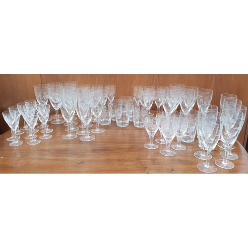 144 - LARGE SELECTION OF GLASSES
all with etched vines to the bowls and comprising twelve white wine, twel... 