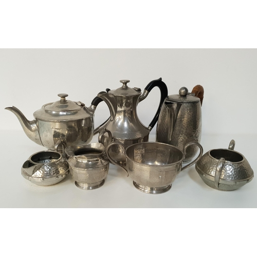 204 - MIXED LOT OF HAMMERED PEWTER
comprising two chocolate pots, tea and coffee pots, hot water pots, sug... 