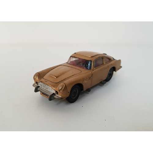 257 - CORGI JAMES BOND ASTON MARTIN DB5 DIE CAST VEHICLE
from the film Goldfinger, finished in gold, with ... 