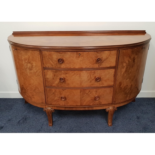 335 - 1950s WALNUT D SHAPED SIDEBOARD
with a raised back above three cockbeaded central drawers, flanked b... 