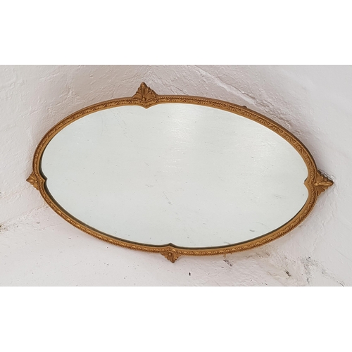 339 - GILT OVAL WALL MIRROR
with a plain plate, 72.5cm wide