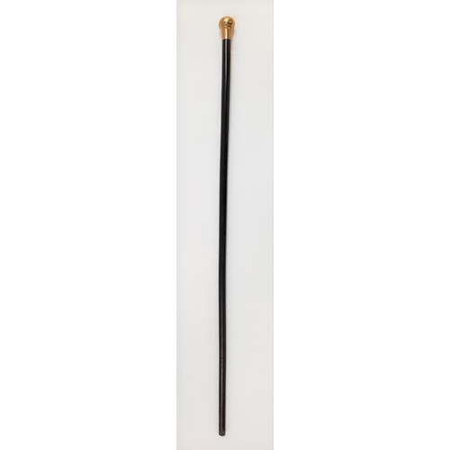 173 - EARLY 20th CENTURY EBONISED WALKING CANE
with a gold top, marks rubbed, 89cm long