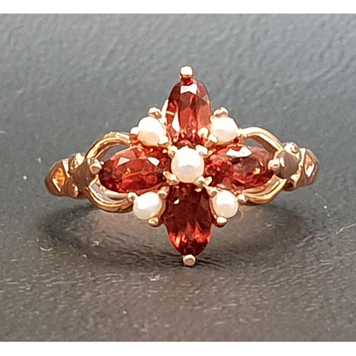 65 - GARNET AND SEED PEARL CLUSTER RING
the four oval cut garnets separated by seed pearls, on nine carat... 