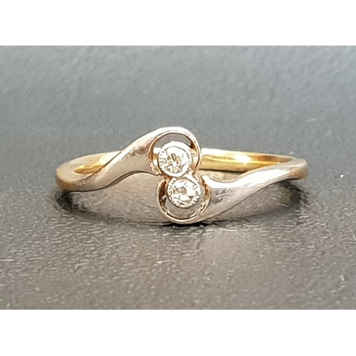 85 - PRETTY DIAMOND TWO STONE RING
on eighteen carat gold shank with twist setting, on eighteen carat gol... 