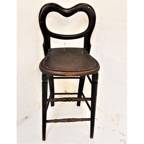 379 - TALL BENTWOOD CHAIR
with a shaped back above a pierced shaped seat, standing on turned supports unit... 